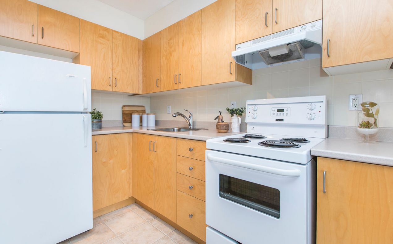 Clean and updated appliances in large kitchen